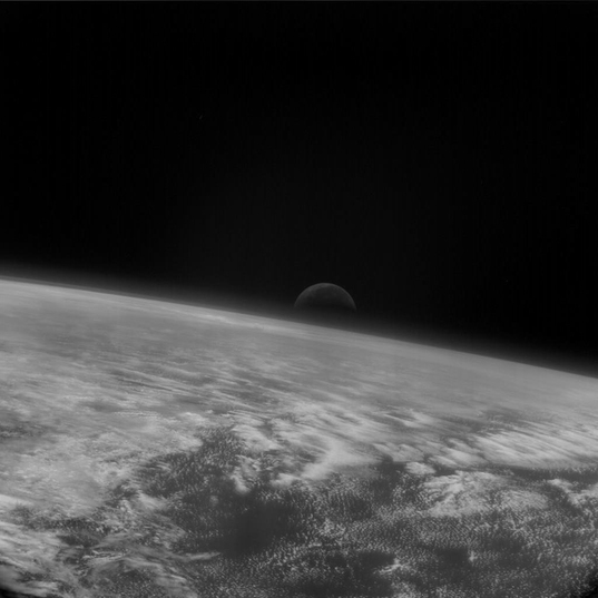 Moonrise over Earth's limb from Rosetta