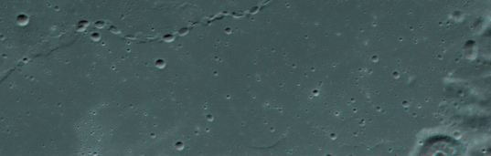 Red-blue anaglyph of a chain of lunar craters