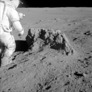 Apollo 14: Alan Shepard checks out a boulder