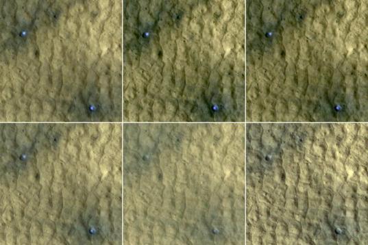 Ice in a pair of fresh craters on Mars fades with time