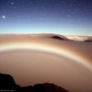 Mars rising over moonbow in Haleakala Crater in Maui