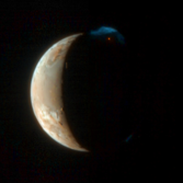 Io erupts, in color