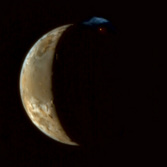 Io erupts, in color