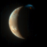Io erupts, in color