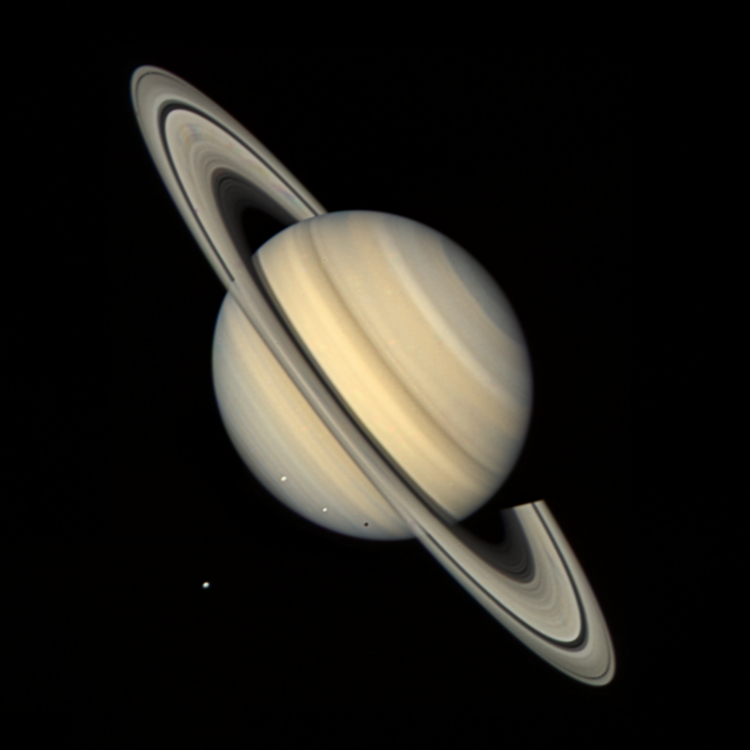 Saturn and its moons from Voyager 2