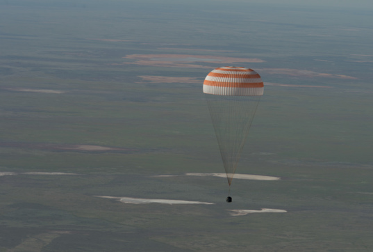 Soyuz sinks toward landing