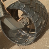 Curiosity's left front wheel, sol 411