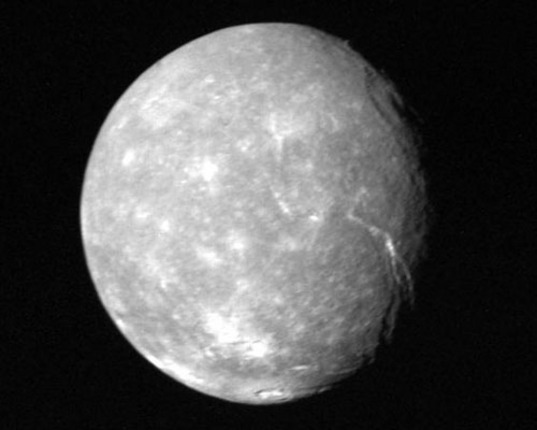 Uranus's moon Titania as seen in low resolution by the Voyager 2 spacecraft in 1986