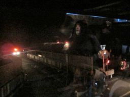 Surreal view from the bus of the evacuation route with reflected images of my fellow evacuees
