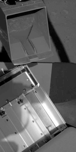 Robotic arm scoop poised over TEGA oven 0, sol 60