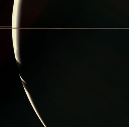 Nearly behind Saturn