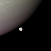 Europa peeks from behind Jupiter
