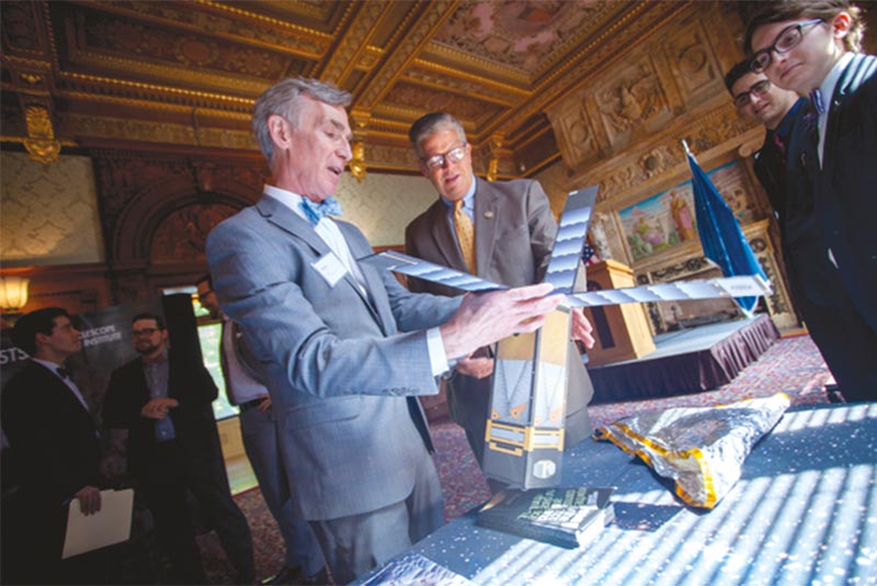 Bill Nye holding LightSail model