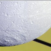 Dione's Evander basin caught against Saturn and rings