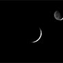 Crescents Dione and Rhea (contrast stretched)