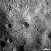 Bright and dark ejecta in one Vesta crater