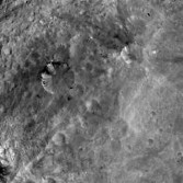 Black streaks in Vestian craters