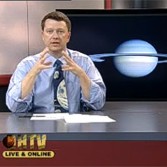 Bruce Betts screen shot teaching CSUDH Introductory Astronomy class with Saturn in background.