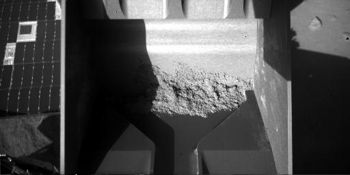 Rasped sample adhered to back of scoop, sol 60