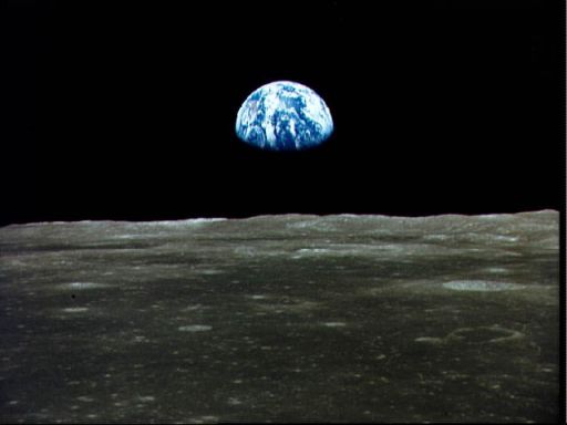 View of Earth rising over Moon's horizon taken from Apollo 11 spacecraft