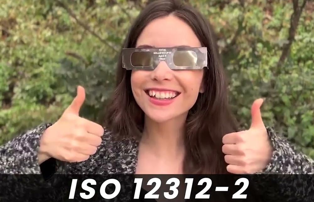 woman wearing ISO certified eclipse glasses