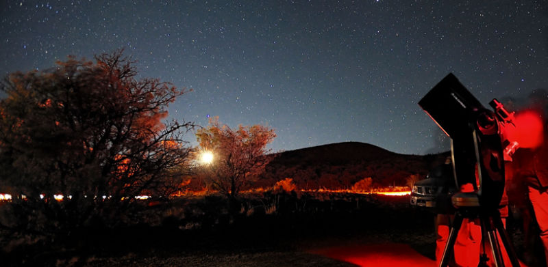 People exploring the night sky with telescopes