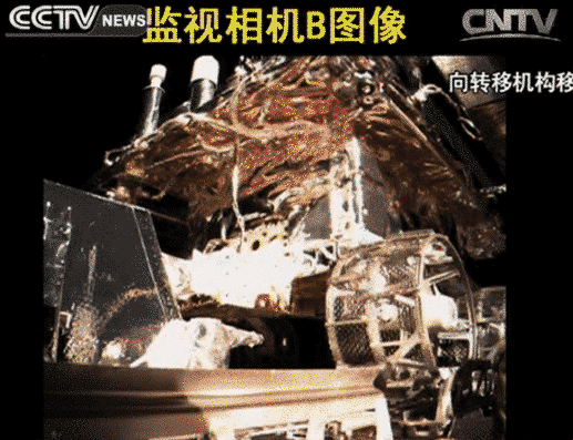 Yutu rover being transferred down from lander toward lunar surface
