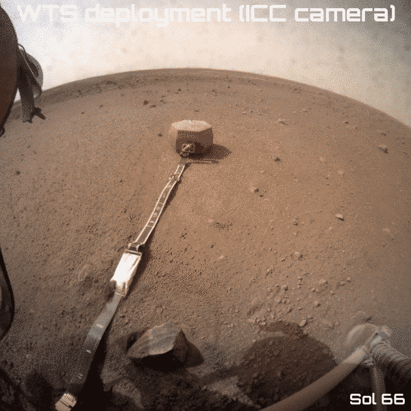 InSight places the SEIS wind and thermal shield, sol 66