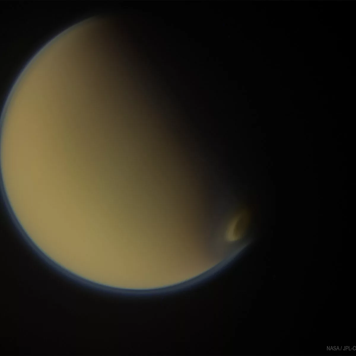 Titan with clouds over south pole