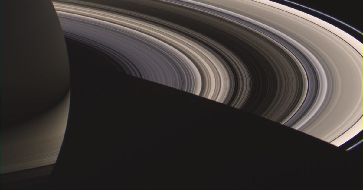 an astronaut sitting on top of a planet. saturn rings. | Stable Diffusion