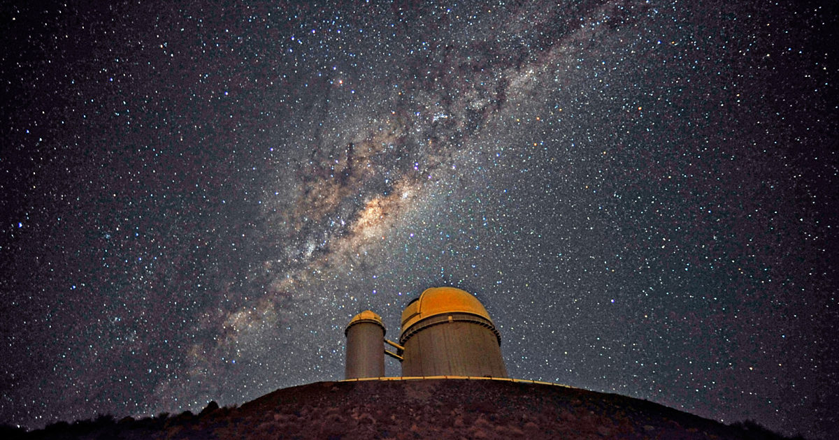 Observatory under starry night sky