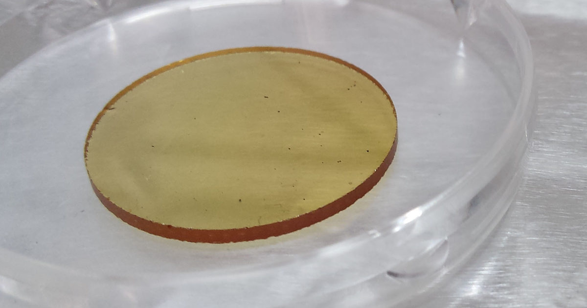 Tholin Material Tholin deposited on a disk for particle size… | The Planetary Society