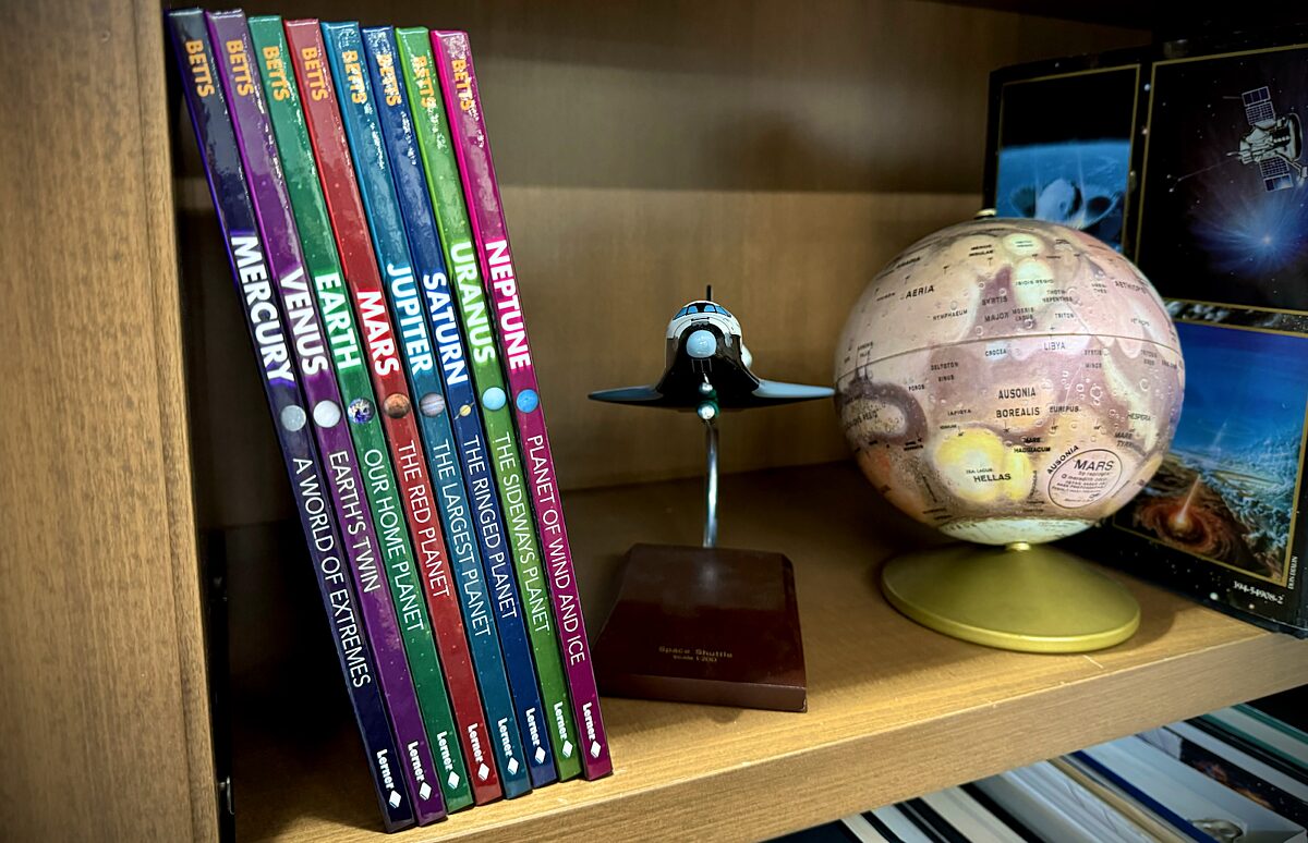 Exploring Our Solar System books on a shelf