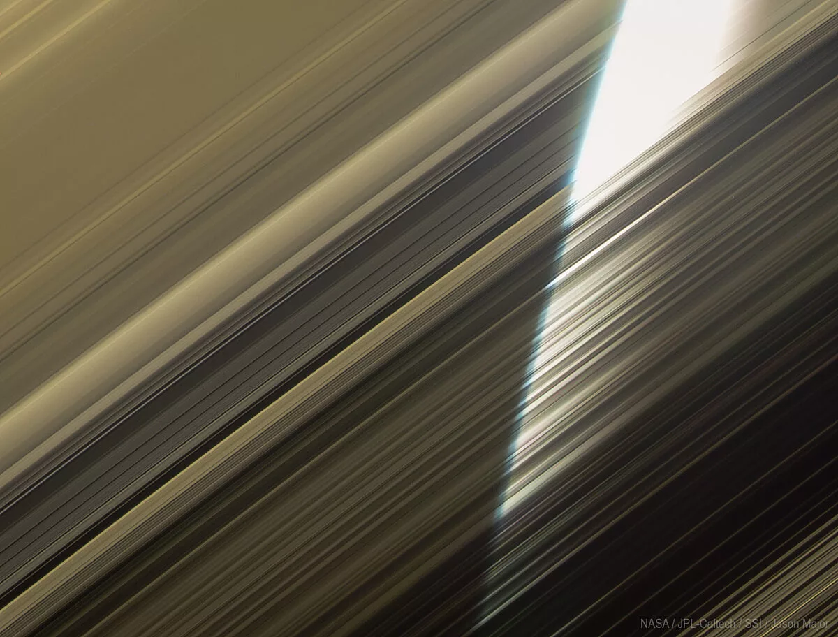 https://planetary.s3.amazonaws.com/web/assets/pictures/_1200x912_crop_center-center_82_line/Sunlit-Saturn-through-Rings.jpg.webp