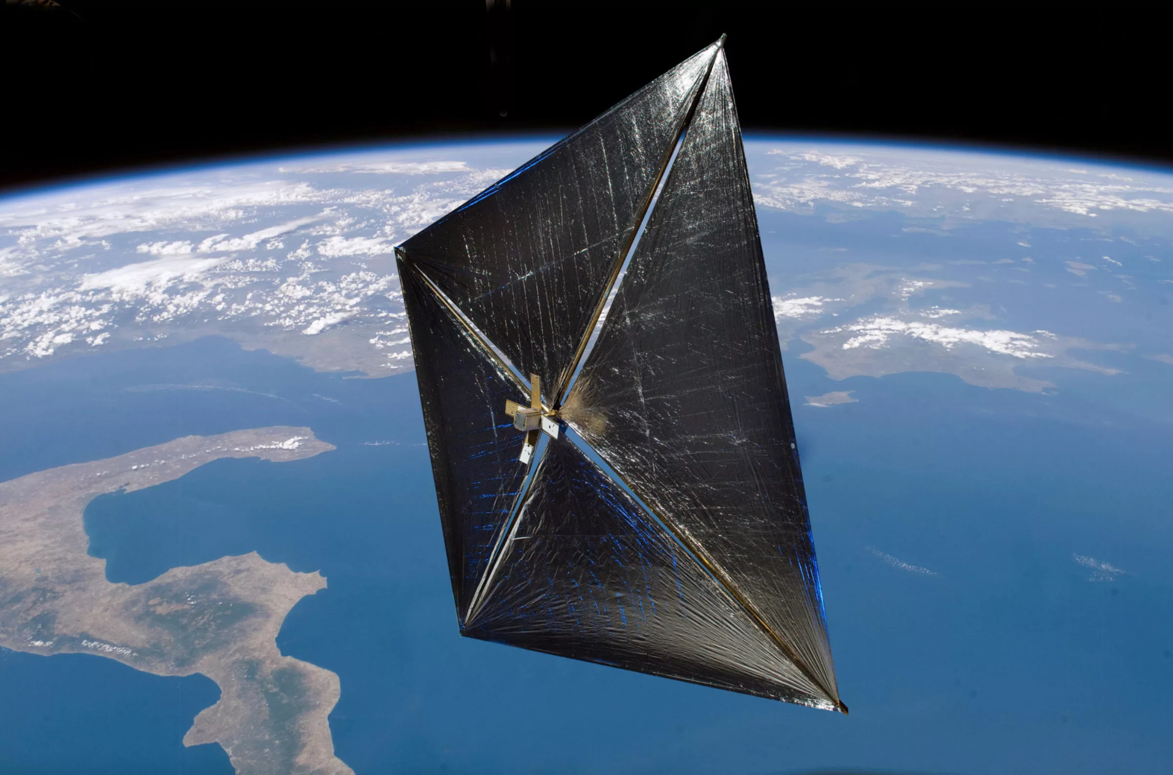 Artist concept of a solar sail in space NASA