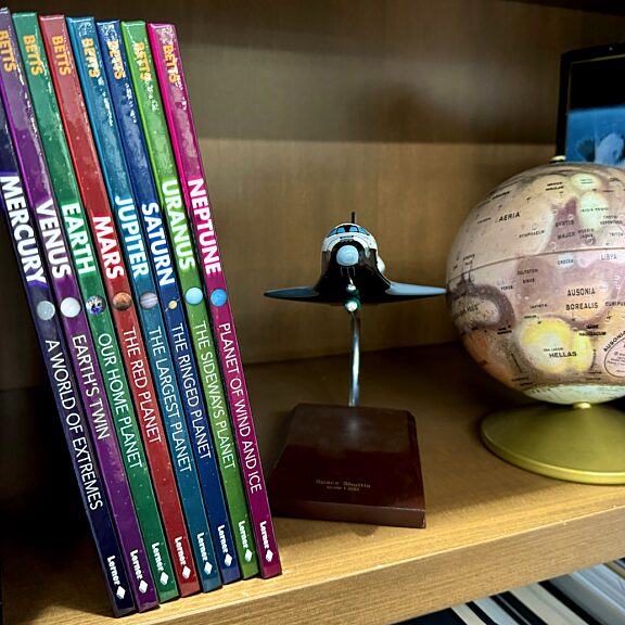 Planetary society solar system books on shelf