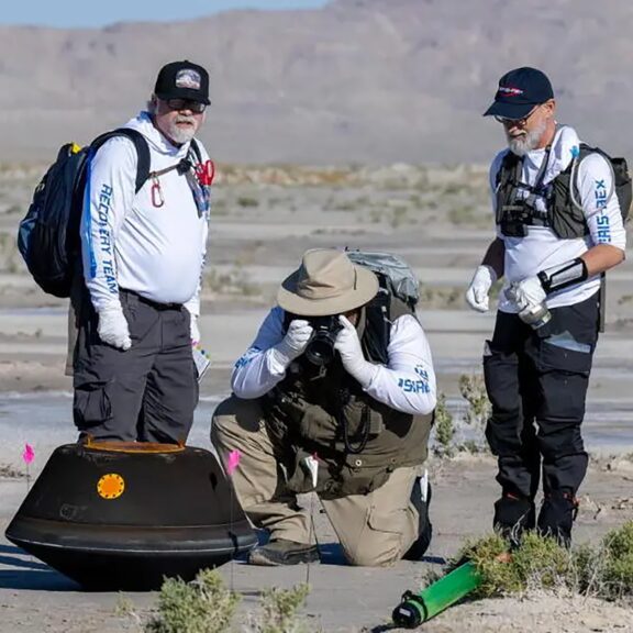 Osiris rex sample capsule with team