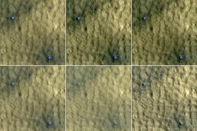 Ice in a pair of fresh craters on Mars fades with time